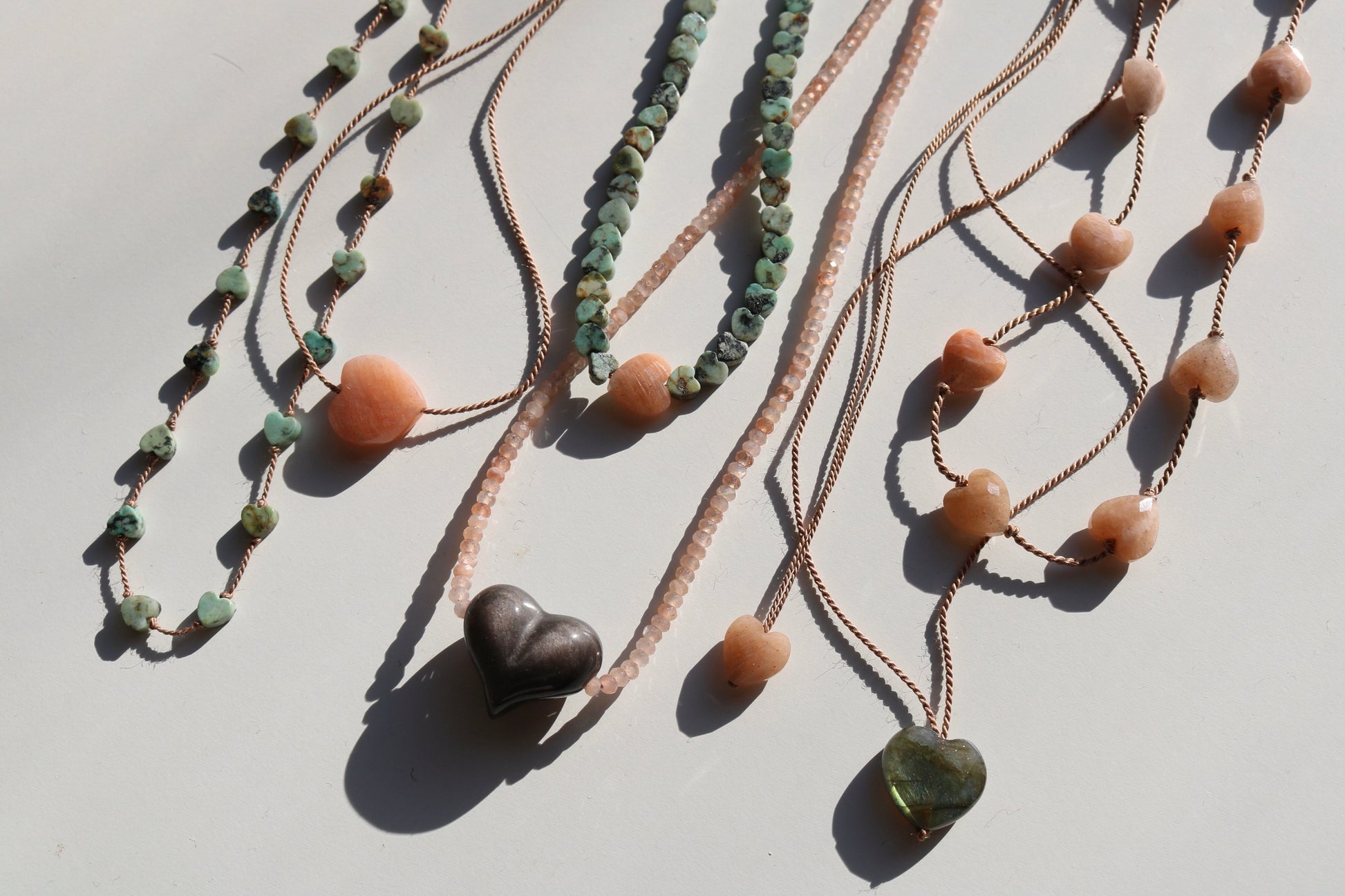 AFRICAN TURQUOISE JASPER & SUNSTONE HEART OM NECKLACE Vibe Necklaces