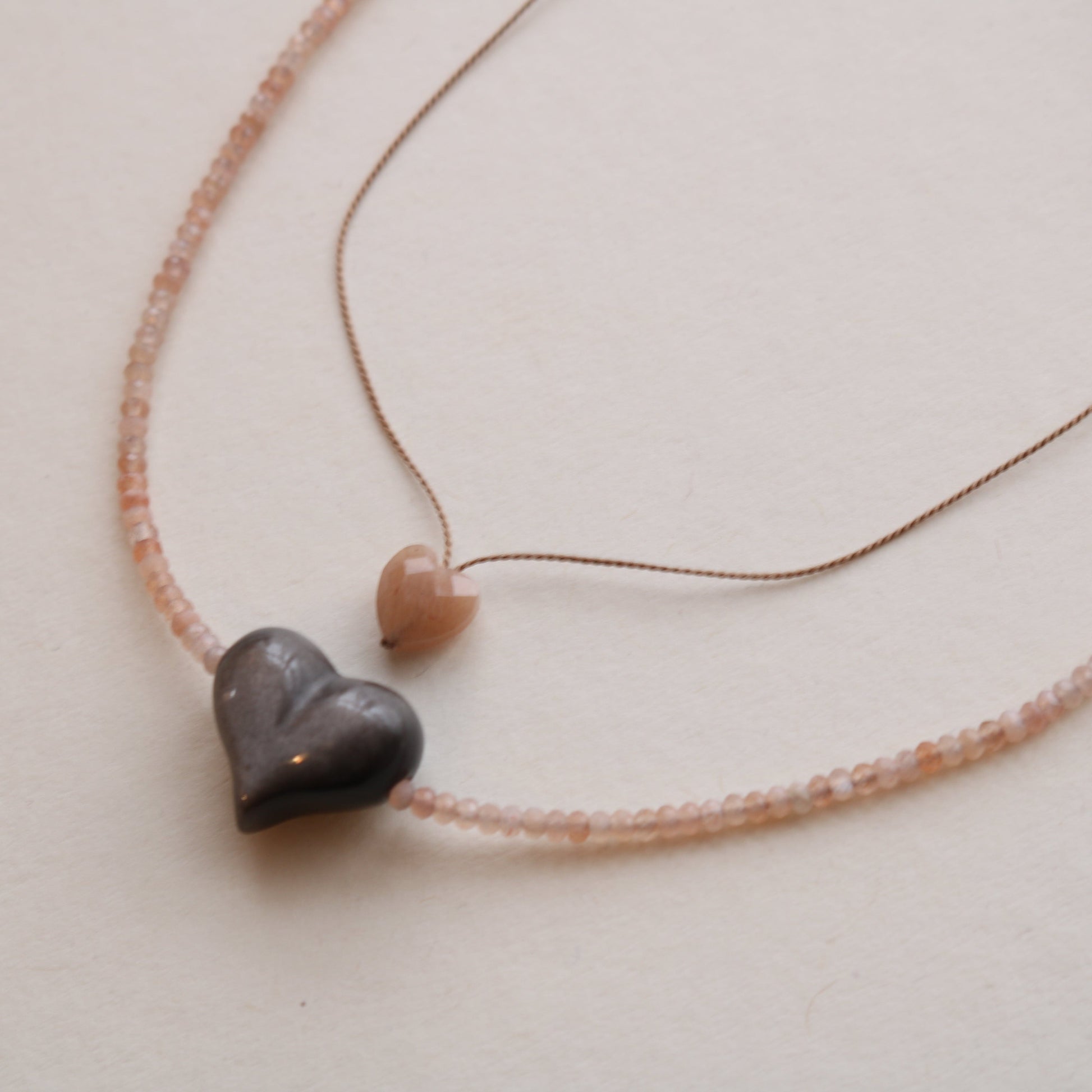 SILVER SHEEN OBSIDIAN HEART + PEACH MOONSTONE OM NECKLACE Vibe Necklaces